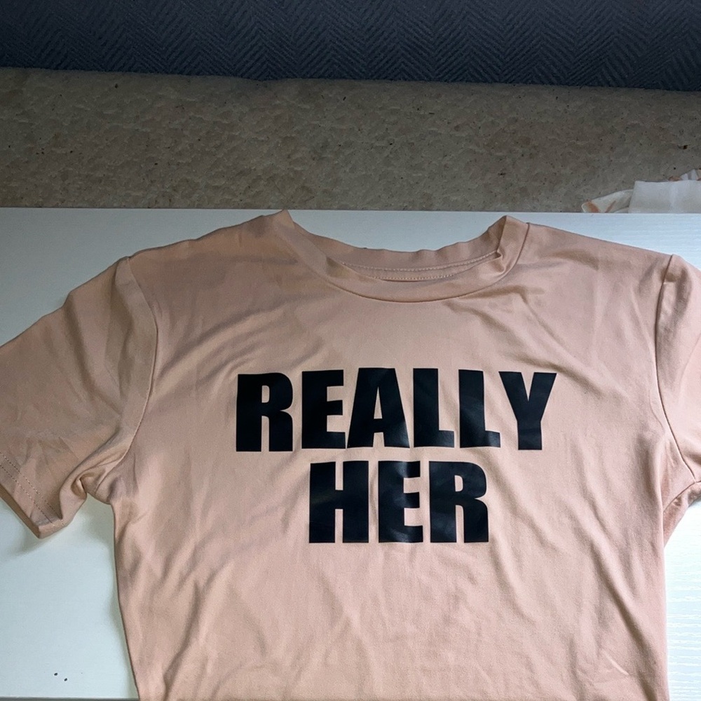 Really her shirt in all black caps shirt color beige size 8